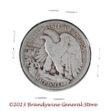 A 1936 Walking Liberty Half Dollar coin in average circulated condition reverse side of coin