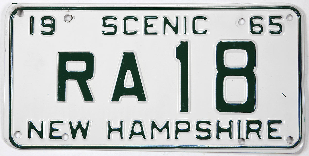 Vintage New Hampshire license plate from 1965 with 'Scenic' and 'RA 18' text.