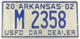 A 2002 Arkansas used car dealer license plate for sale by Brandywine General Store in very good plus condition