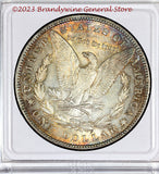 An 1886 Morgan Silver Dollar in extra fine or better condition with nice rainbow toning reverse side