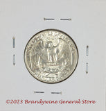 A 1954 silver Washington quarter in choice almost uncirculated condition reverse side
