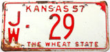 A 1957 Kansas passenger car license plate in very good minus condition