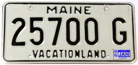 A classic 1986 Maine DMV car license plate in excellent minus condition