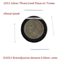 An 1853 Silver Three Cent Piece Trime in about good condition