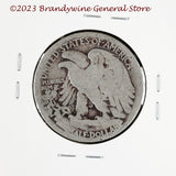 A 1920 Walking Liberty Half Dollar coin in average circulated condition reverse side of coin