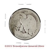 A 1927-S Walking Liberty Half Dollar coin in average circulated condition reverse side of coin
