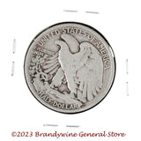A 1929-S Walking Liberty Half Dollar coin in average circulated condition reverse side of coin