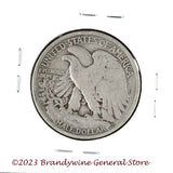 A 1934 Walking Liberty Half Dollar coin in average circulated condition reverse side of coin