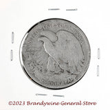 A 1936-S Walking Liberty Half Dollar coin in average circulated condition reverse side of coin