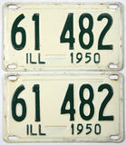 Pair of vintage Illinois license plates from 1950 with green text on a white background.