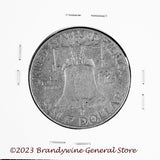 A 1952-D Franklin Half Dollar in average circulated condition reverse side of coin