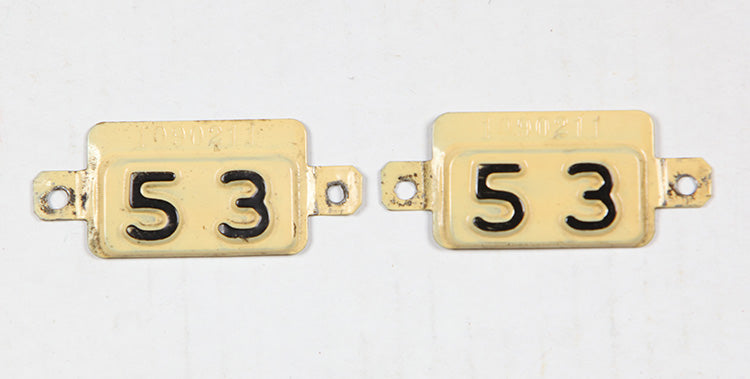 Antique pair of 1953 New Jersey metal date tabs for use on 1952 base car license plates