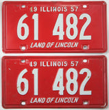 antique pair of 1957 Illinois car license plate being red with white lettering