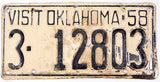 Vintage license plate from Oklahoma with text 'VISIT OKLAHOMA 58' and numbers '3-12803'.