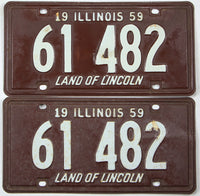 Pair of vintage Illinois license plates from 1959 with the text 'Land of Lincoln'.