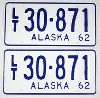 A pair of antique unused 1962 Alaska light truck license plates for sale by Brandywine General Store in near mint condition with wrapper