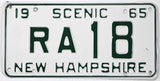 Vintage New Hampshire license plate from 1965 with 'Scenic' and 'RA 18' text.