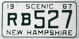 Vintage New Hampshire license plate with text '1967 Scenic RB527' on a white background