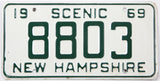 Vintage New Hampshire license plate from 1969 with the text 'Scenic 69' and number '8803'.