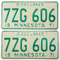 Pair of vintage 1971 Minnesota car license plates with green text on a white background.