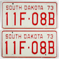 pair of NOS 1973 South Dakota Farm license plates grading unused excellent
