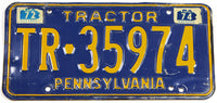 A 1974 Pennsylvania tractor license plate for sale by Brandywine General Store in very good condition wtih bends
