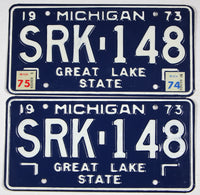 A pair of classic 1975 Michigan Car License Plates made of steel for sale by Brandywine General Store in excellent condition