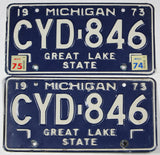 A pair of classic 1975 Michigan Car License Plates made of steel for sale by Brandywine General Store in very good plus condition
