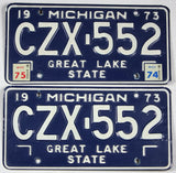 A pair of classic 1975 Michigan Car License Plates made of steel for sale by Brandywine General Store in excellent minus condition