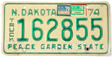 1979 ND truck license plate with green text on a beige background