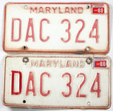 A pair of 1980 Maryland license plates grading good with bends