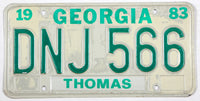 A vintage 1983 Georgia passenger automobile license plate for sale by Brandywine General Store in very good plus condition with discoloring