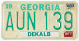 A vintage 1985 Georgia passenger automobile license plate for sale by Brandywine General Store from Dekalb county