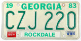 A vintage 1985 Georgia passenger automobile license plate for sale by Brandywine General Store from Rockdale county