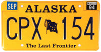 A single 1994 Alaska passenger car license plate available for sale at Brandywine General Store in excellent condition