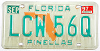 A 1997 Florida passenger car license plate for sale by Brandywine General Store in very good plus condition with some discoloring