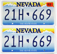 Pair of classic 2003 Nevada car license plates grading very good plus with long scratch on one