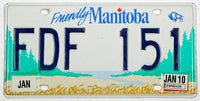 A 2010 Manitoba Canada passenger car license plate for sale at Brandywine General Store in excelletn minus condition with scratches
