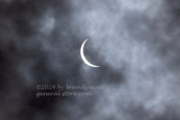 An original premium Quality Art Print of Solar Eclipse 2024 Beginning under a Cloudy sky for sale by Brandywine General Store