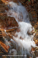 An original premium quality art print of Waterfall in Slow Motion over Red Rocks for sale by Brandywine General Store
