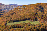 art print of small hayfield in center of autumn colored mountains