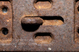 art print of macro photo of antique iron strap in old corn crib