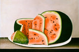 Sliced watermelon on a white plate with a neutral background