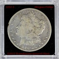 An 1892-S Morgan better date Silver Dollar in average circulated condition