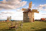 An archival premium Quality Art Print of a Windmill on a Round Stone Building and Wooden Cart for sale by Brandywine General Store