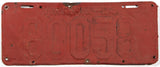 An antique 1924 Virginia car license plate in fair condition with extra holes and red primer paint