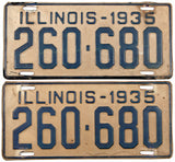 An antique pair of 1935 Illinois passenger car license plates in very good condition with original mailing envelope
