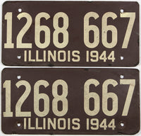 An antique pair of WWII 1944 Illinois car licenese plates with original mailing envelope
