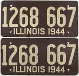 An antique pair of WWII 1944 Illinois car licenese plates with original mailing envelope