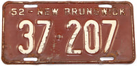 An antique 1952 New Brunswick passenger car license plate in very good minus condition